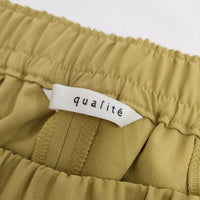 qualite ポリエステルイージースリットパンツ 2WAYストレッチセンターベンツパンツ パンツ マスタード レディース カリテ【中古】5-0419G∞